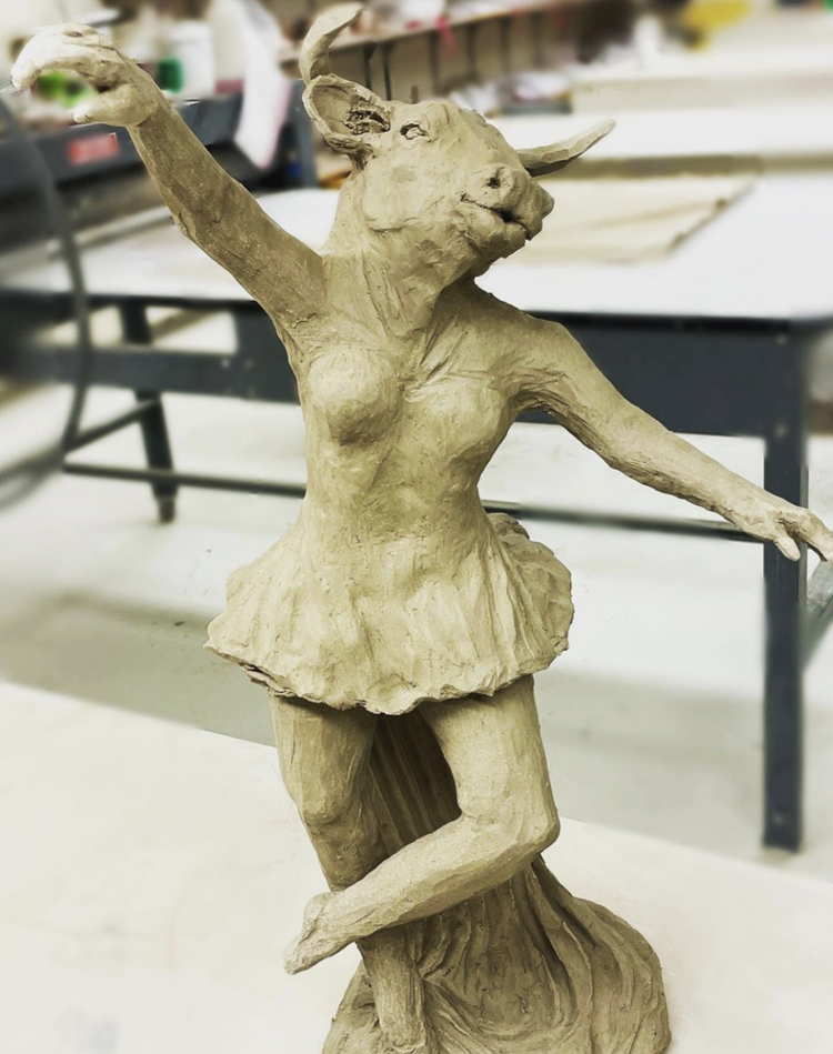 unfinished pottery statue of a bull woman hybrid